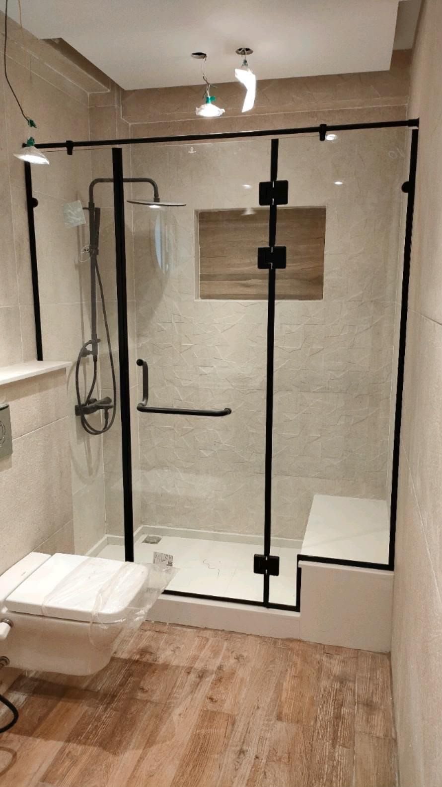 Frameless glass shower cubicle in a premium bathroom