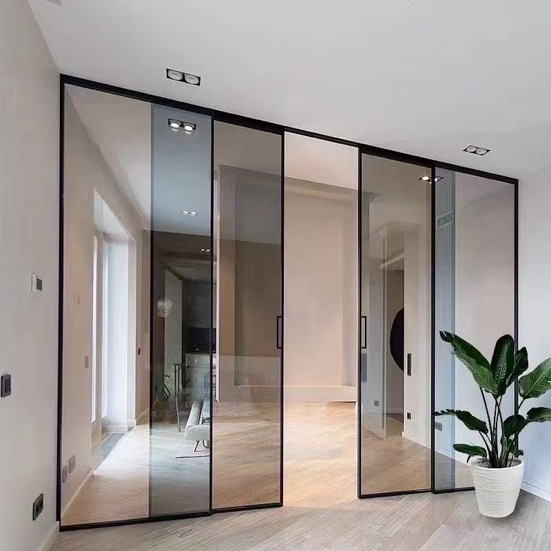 Slim sliding aluminium profile system installed in a modern interior